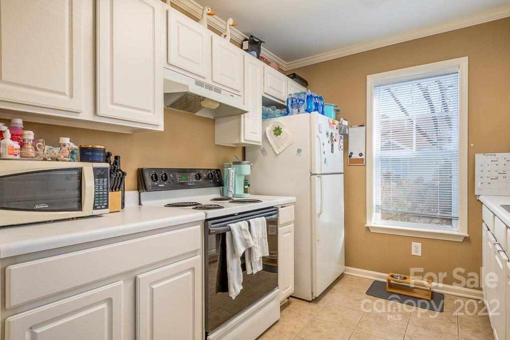 17341 Villanova Road Huntersville, NC 28078 - Photo 7 of 17 a kitchen with stainless steel appliances granite countertop a refrigerator a stove and a sink with granite countertops