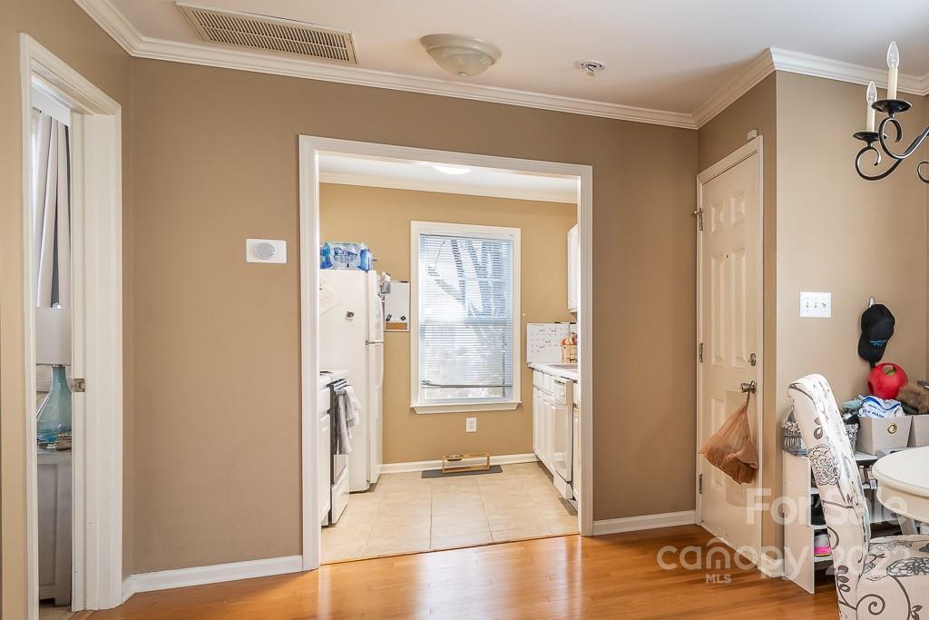 17341 Villanova Road Huntersville, NC 28078 - Photo 9 of 17 a view of a hallway with wooden floor and a living room