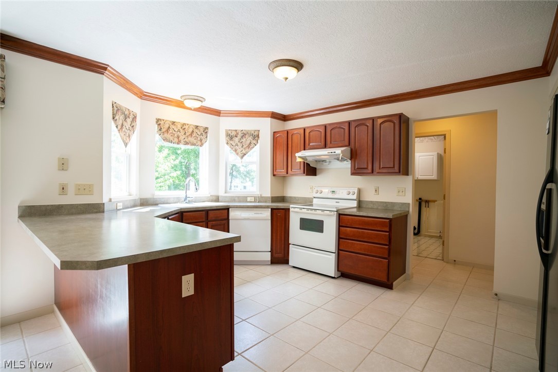 1380 Walnut Ridge Drive Uniontown, OH 44685 - Photo 16 of 35 Bayed Kitchen with Breakfast Bar which offers additional seating!