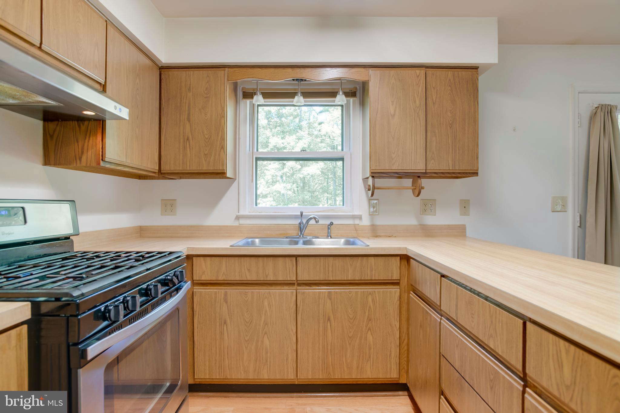 803 Weaver Hollow Road Banco, VA 22711 - Photo 6 of 67 a kitchen with stainless steel appliances a sink stove and cabinets