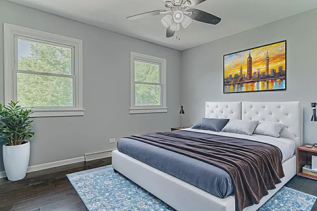 a bedroom with bed and window