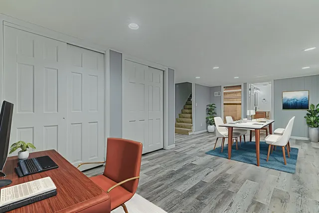 a living room with furniture a window and a table