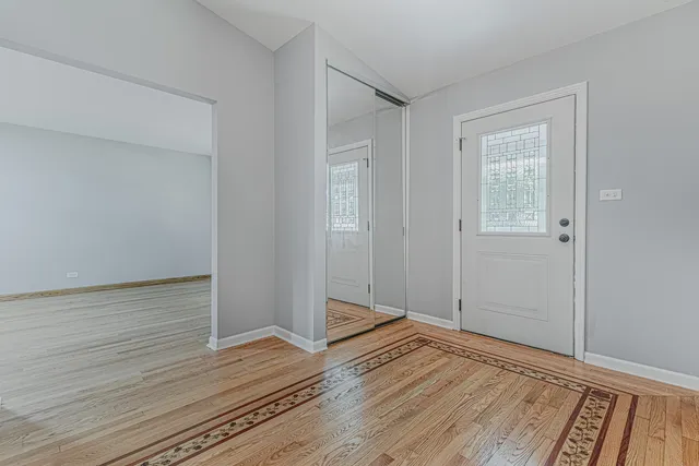 a view of a livingroom with wooden floor and closet