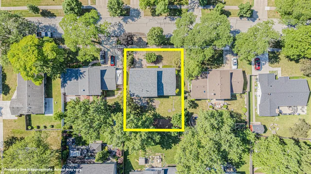 an aerial view of residential house with outdoor space and swimming pool