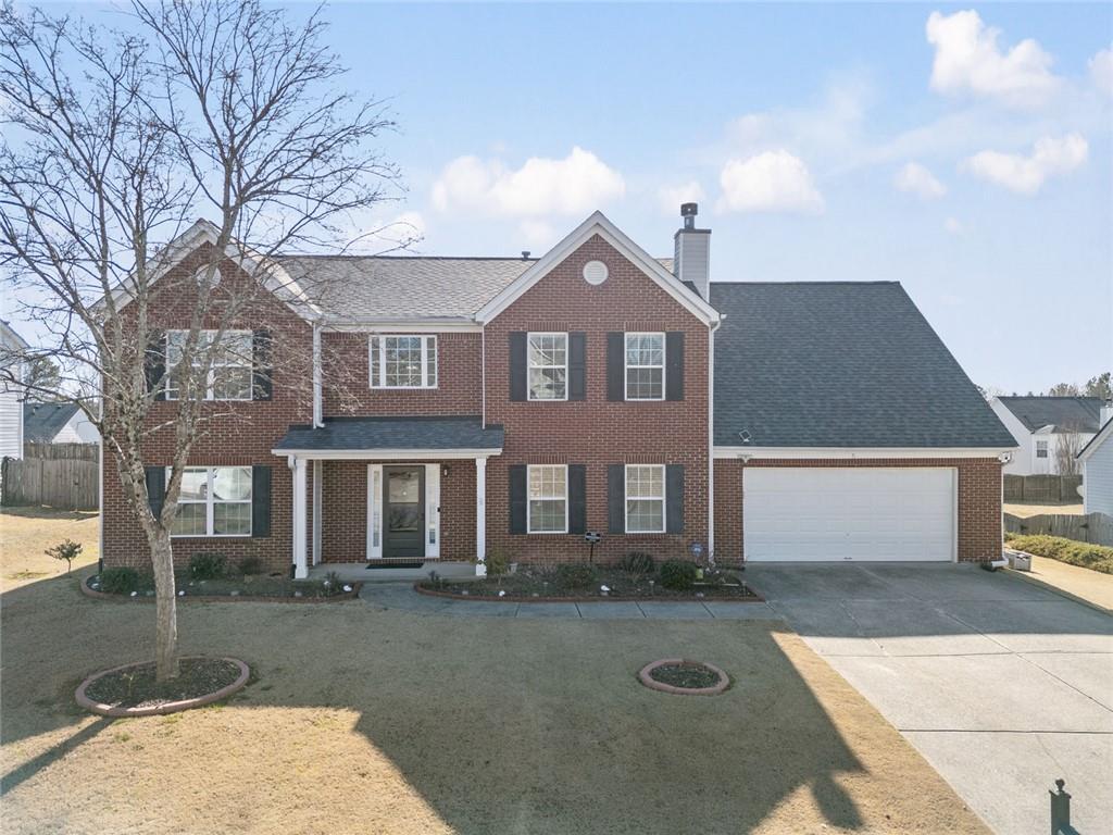 front view of a house with a yard