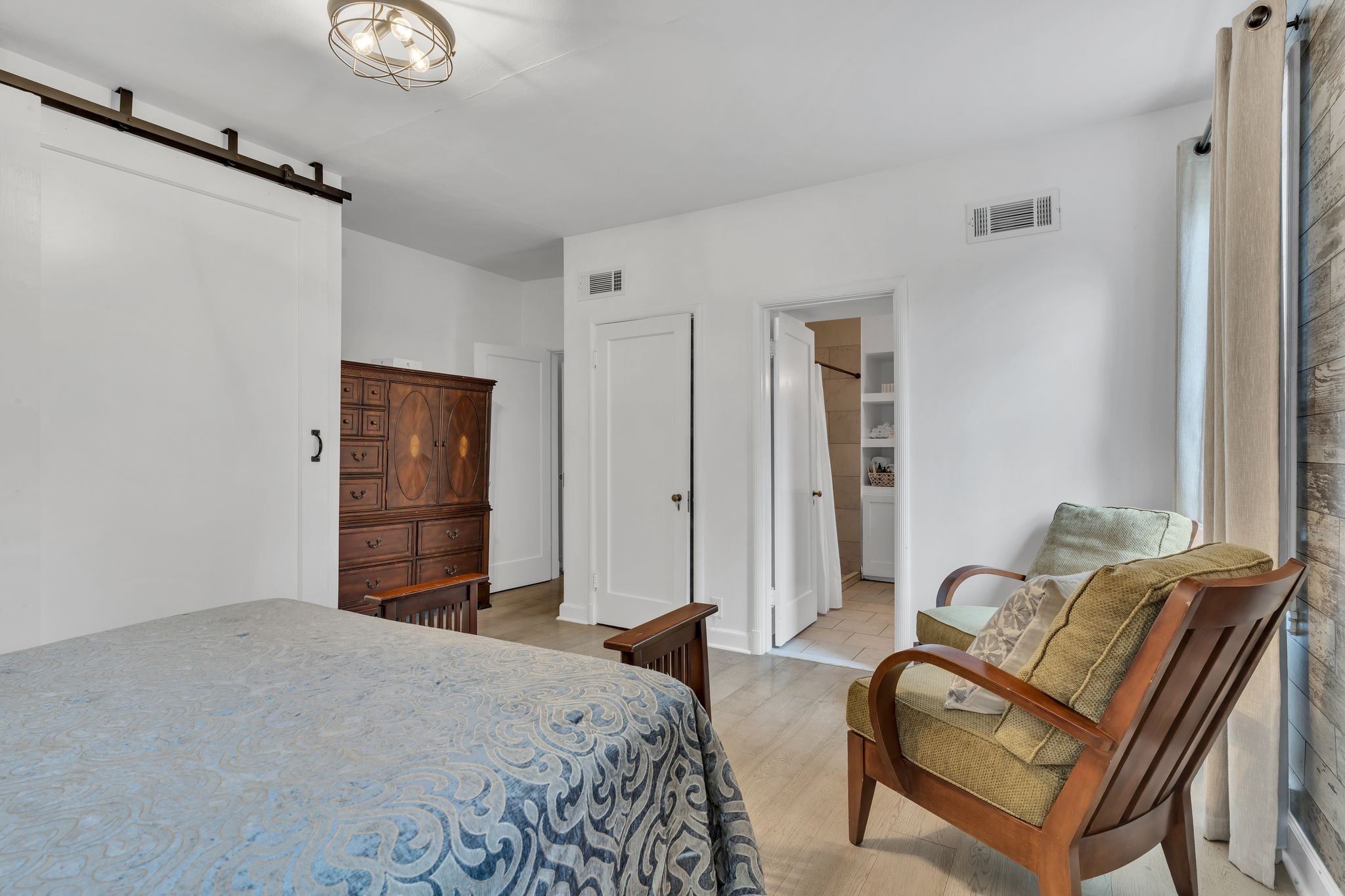 305 Connell Street Springfield, TN 37172 - Photo 17 of 46 a bedroom with a bed and a couch