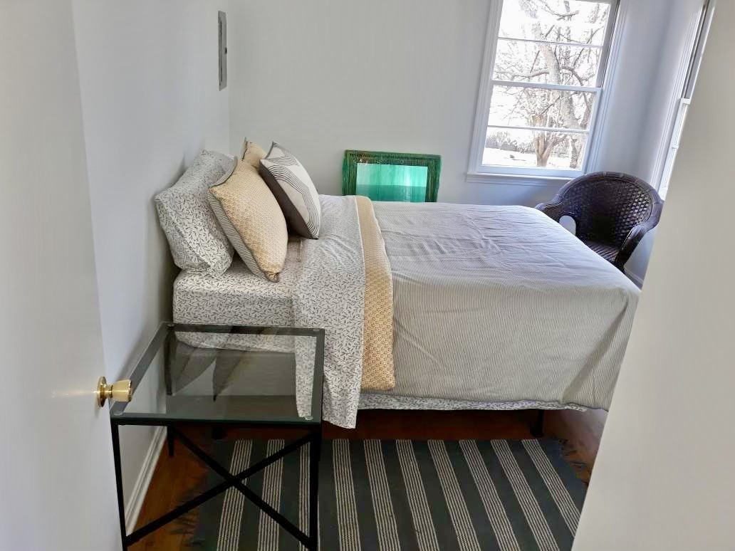 305 Connell Street Springfield, TN 37172 - Photo 36 of 46 a bed sitting in a bedroom next to a window