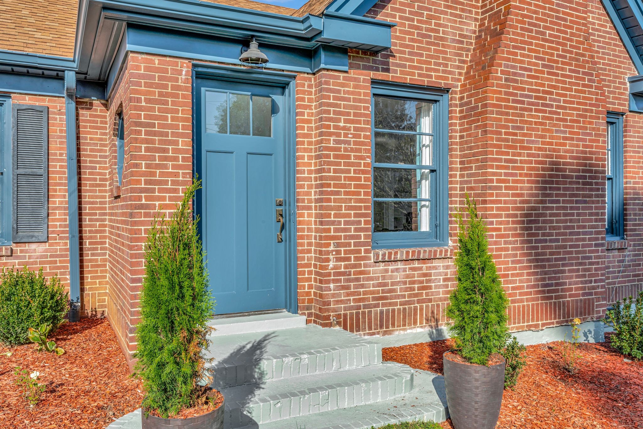 305 Connell Street Springfield, TN 37172 - Photo 4 of 46 a potted plant sitting in front of a house