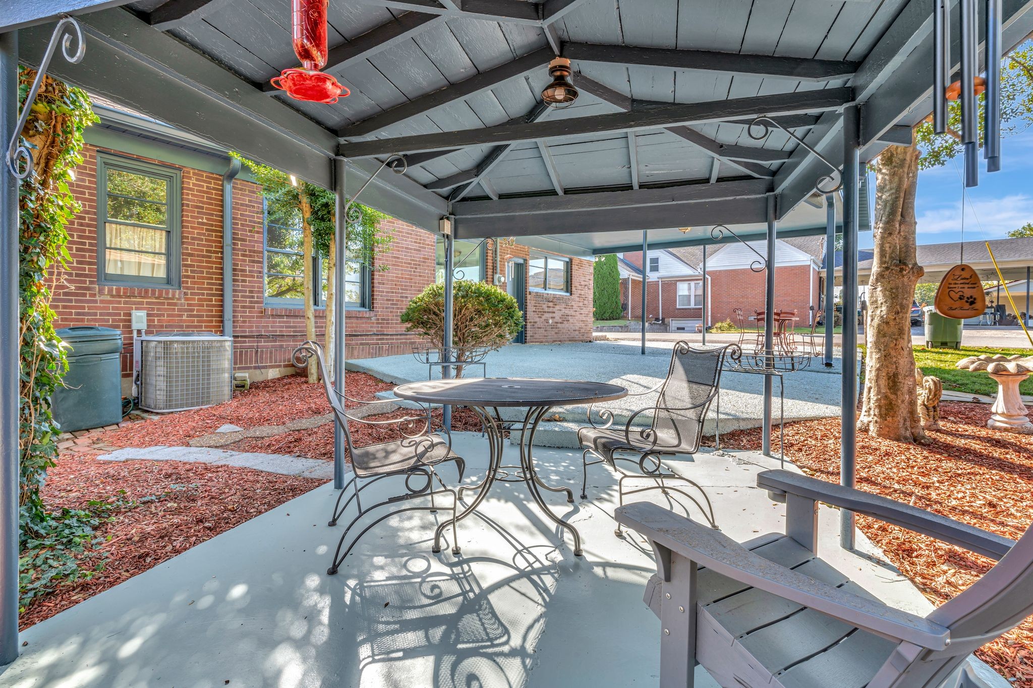 305 Connell Street Springfield, TN 37172 - Photo 45 of 46 a view of a patio with a table and chairs under an umbrella