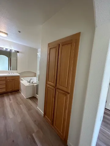 a bathroom with a sink a mirror and a toilet
