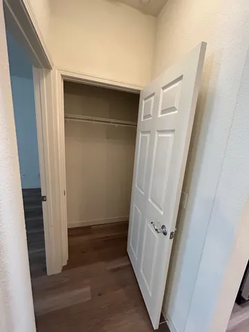 an entryway door with white walls