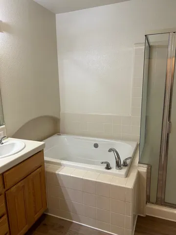 a bathroom with a bathtub and sink