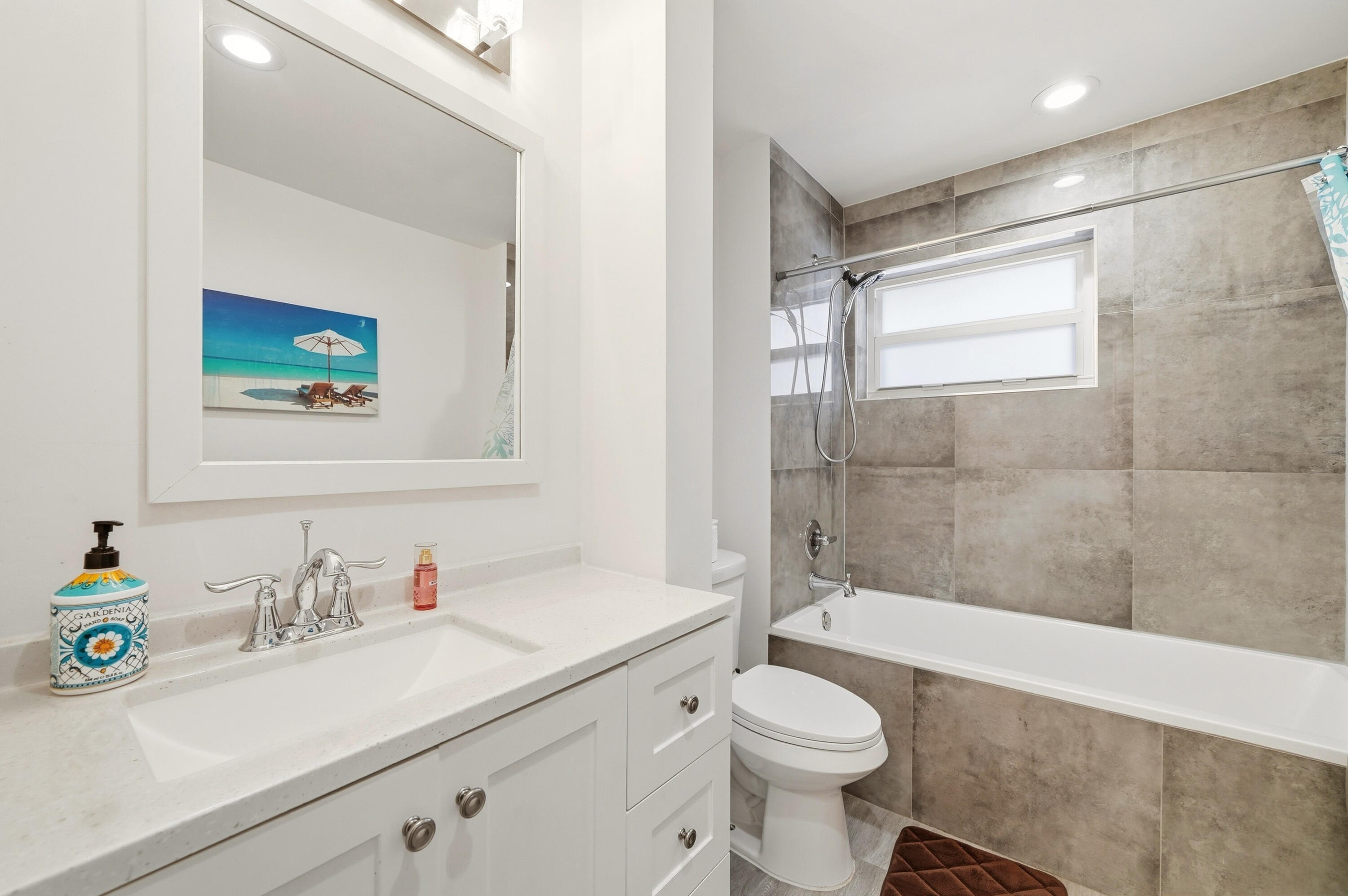3510 Harrison Street, Unit 4 Hollywood, FL 33021 - Photo 14 of 31 a bathroom with a sink toilet and shower