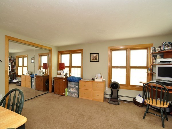 22 Hudson Road Stow, MA 01775 - Photo 12 of 28 a living room with furniture and a flat screen tv