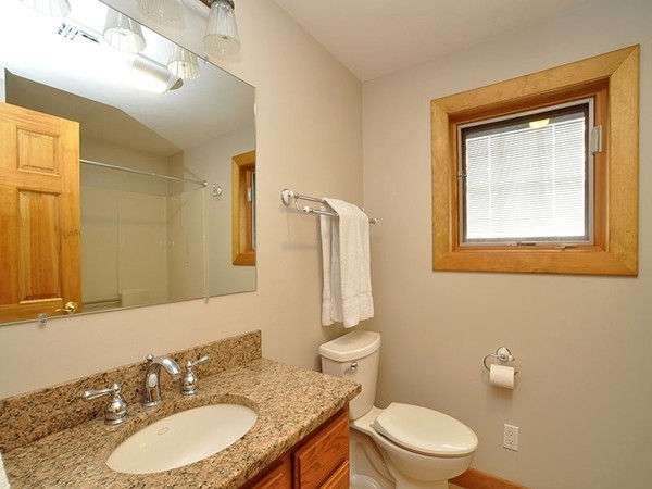 22 Hudson Road Stow, MA 01775 - Photo 23 of 28 a bathroom with a granite countertop toilet sink and mirror