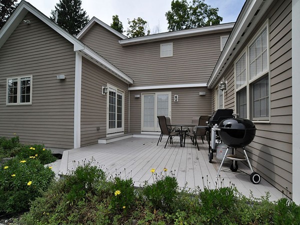 22 Hudson Road Stow, MA 01775 - Photo 25 of 28 a backyard of a house with table and chairs