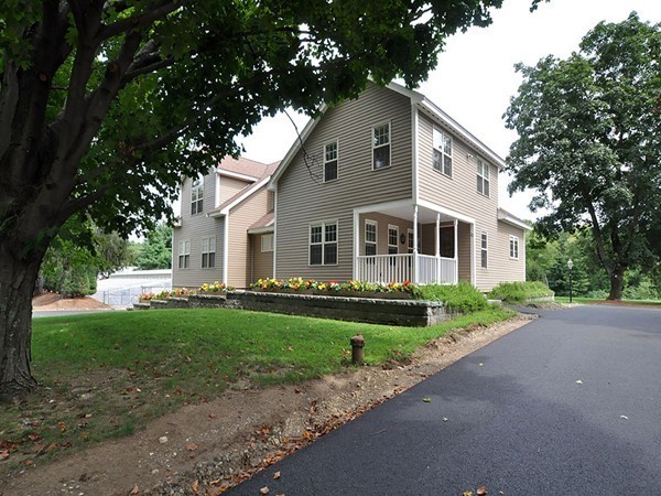 22 Hudson Road Stow, MA 01775 - Photo 3 of 28 a front view of a house with a yard