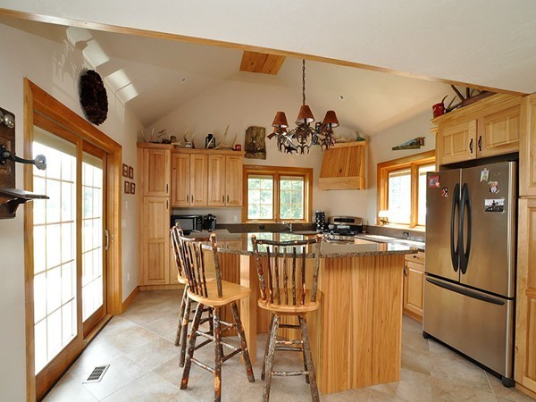 22 Hudson Road Stow, MA 01775 - Photo 5 of 28 a view of a dining room with furniture a chandelier and large window