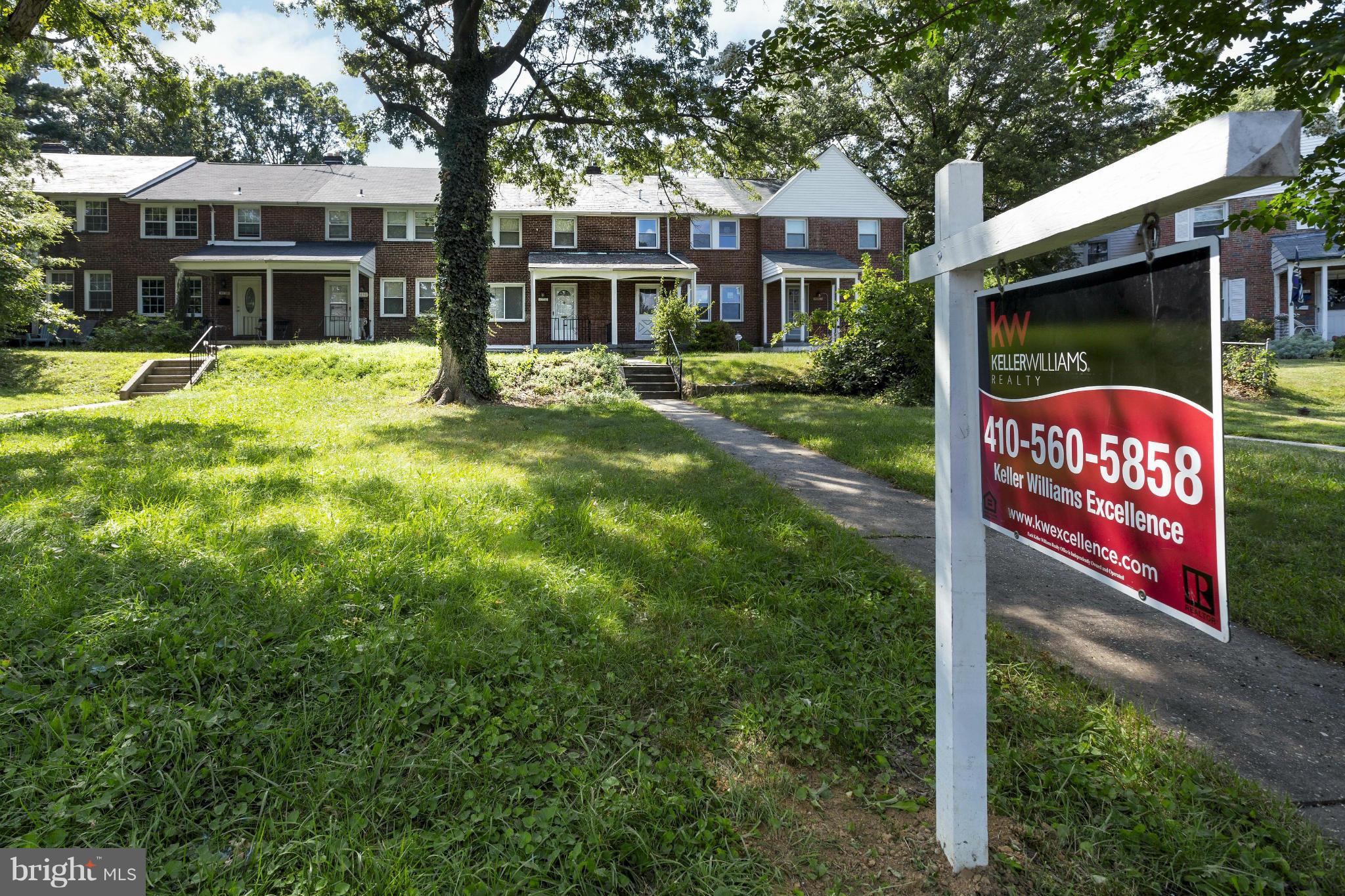 4658 Marble Hall Road Baltimore, MD 21239 - Photo 3 of 23 a sign that is sitting in front of a brick house