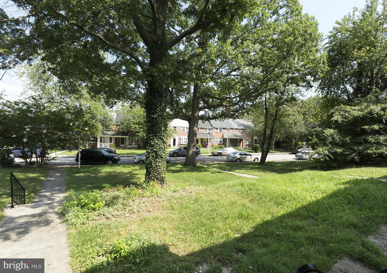 4658 Marble Hall Road Baltimore, MD 21239 - Photo 5 of 23 a view of swimming pool with sitting area and garden