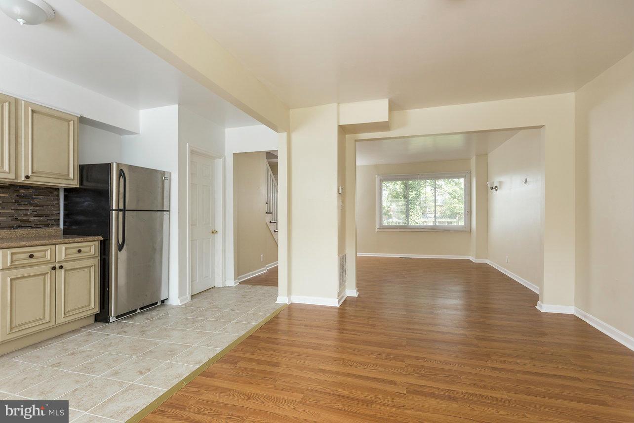 4658 Marble Hall Road Baltimore, MD 21239 - Photo 10 of 23 a view of a kitchen with refrigerator and wooden floor