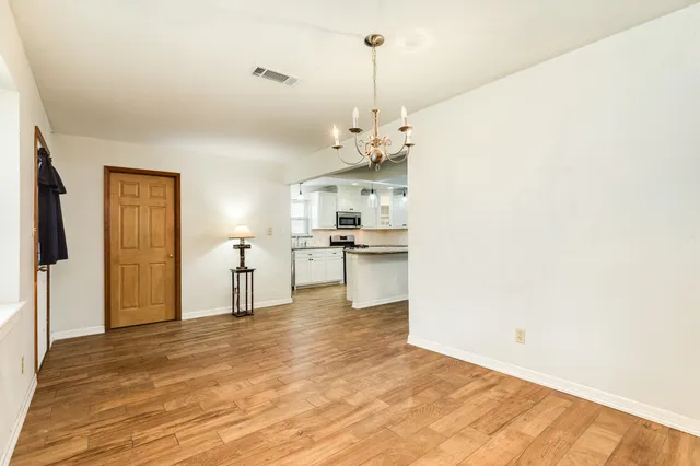 a bed room with a bed and a ceiling fan