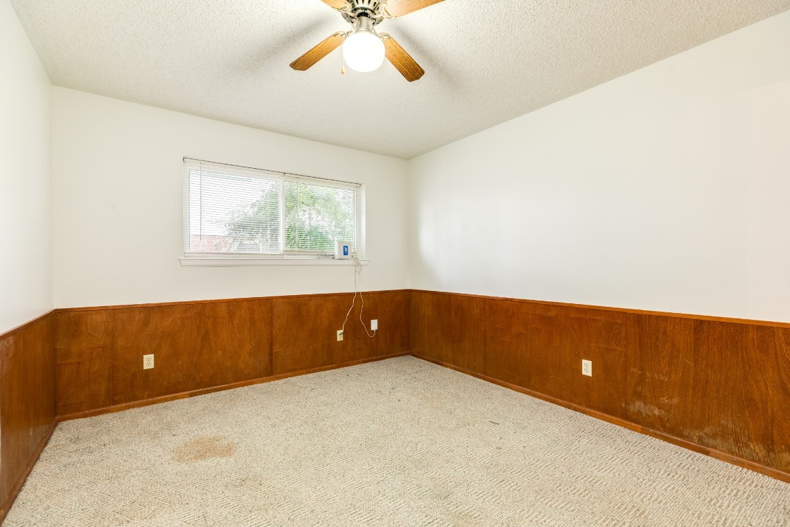 52 South Bachelor Button Street Lake Jackson, TX 77566 - Photo 21 of 45 a view of room with window and a ceiling fan