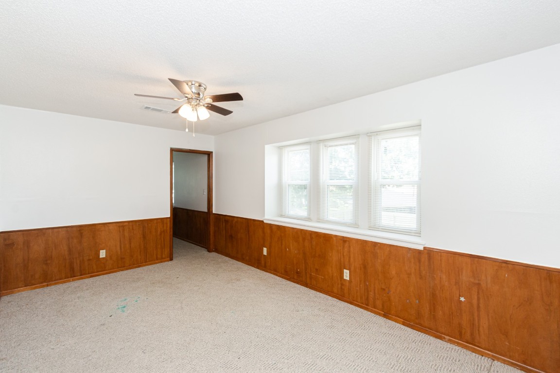 52 South Bachelor Button Street Lake Jackson, TX 77566 - Photo 25 of 45 an empty room with chandelier fan