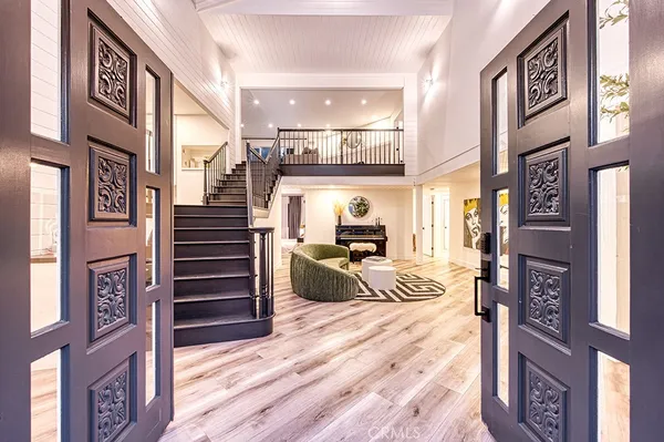 a view of a entryway with stairs and furniture