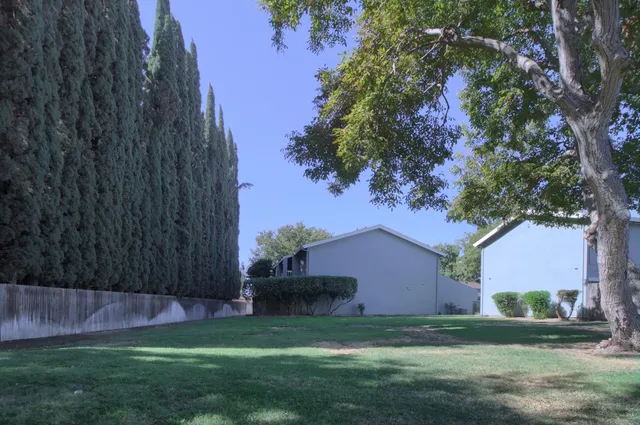 a view of swimming pool with a yard