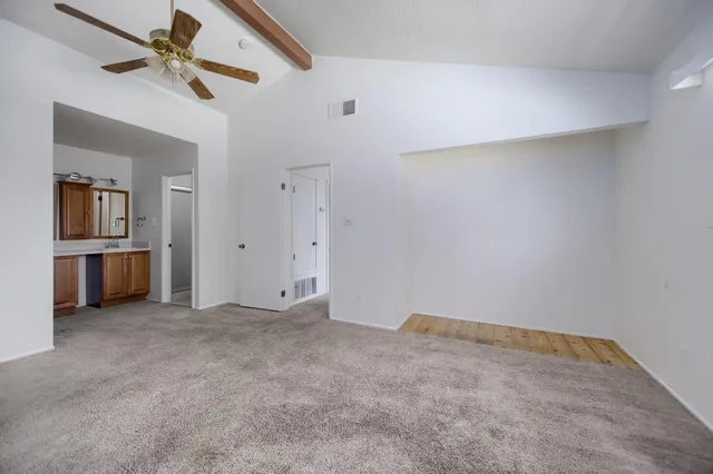 a bathroom with a double vanity sink and mirror