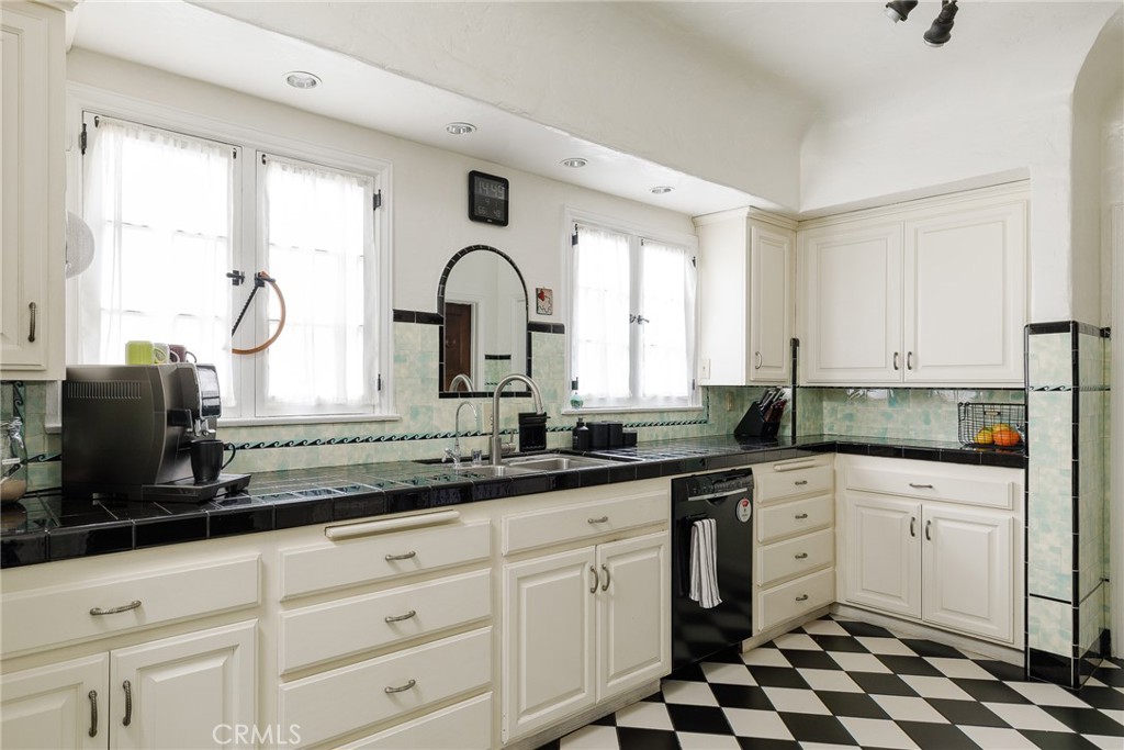 7 South 37th Place Long Beach, CA 90803 - Photo 17 of 52 a kitchen with granite countertop white cabinets and appliances