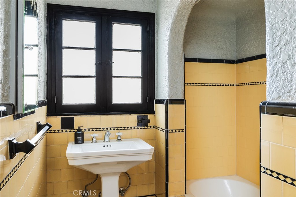 7 South 37th Place Long Beach, CA 90803 - Photo 19 of 52 a bathroom with a sink and a mirror