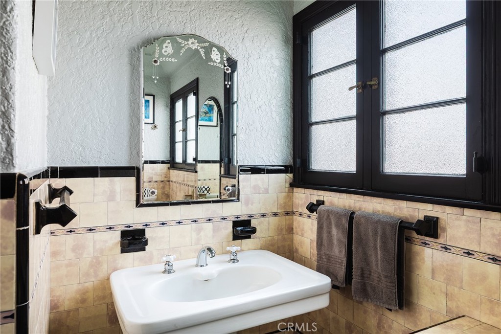 7 South 37th Place Long Beach, CA 90803 - Photo 31 of 52 a bathroom with a sink and a mirror