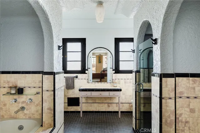 a bedroom with furniture and a wooden floor