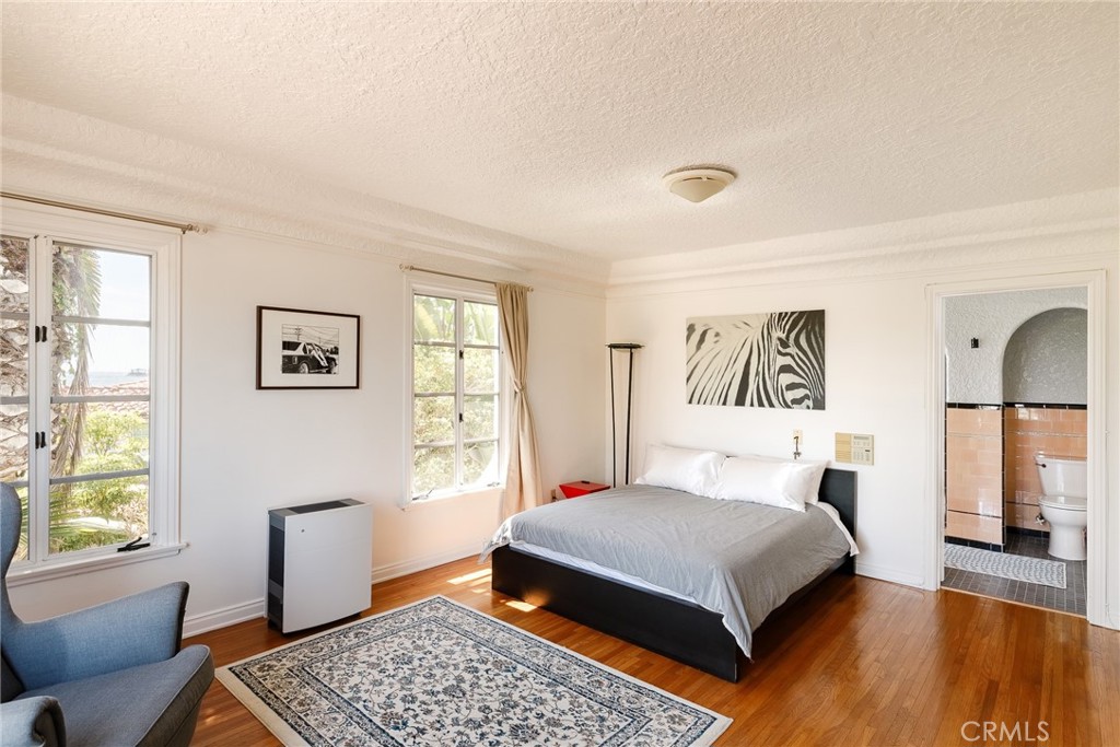 7 South 37th Place Long Beach, CA 90803 - Photo 35 of 52 a bedroom with a large bed and a couch