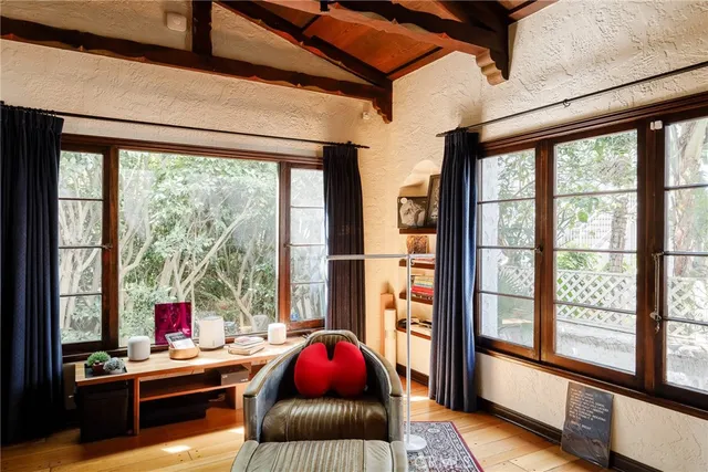 a view of a dining room with furniture window and wooden floor