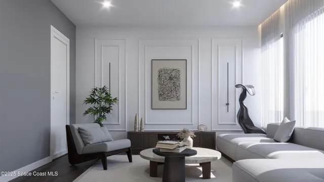 a living room with furniture and a potted plant