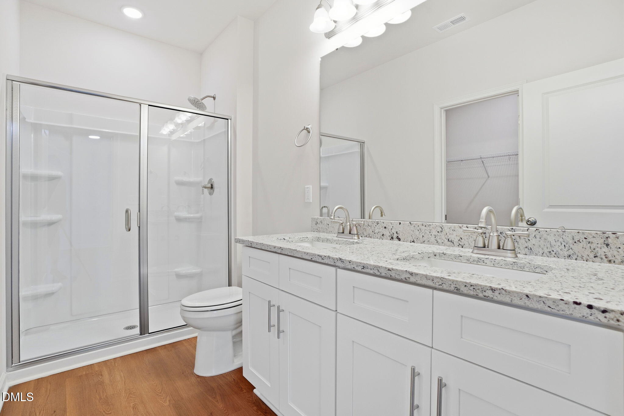 9019 Phoenix Court Spring Hope, NC 27882 - Photo 25 of 34 a bathroom with a granite countertop sink a toilet and shower