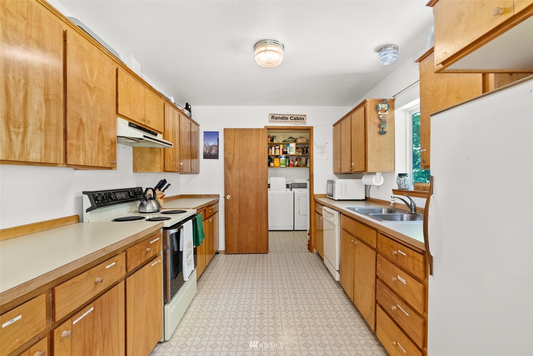 2158 Cispus Road Randle, WA 98377 - Photo 11 of 36 a kitchen with stainless steel appliances granite countertop a stove a sink and a refrigerator