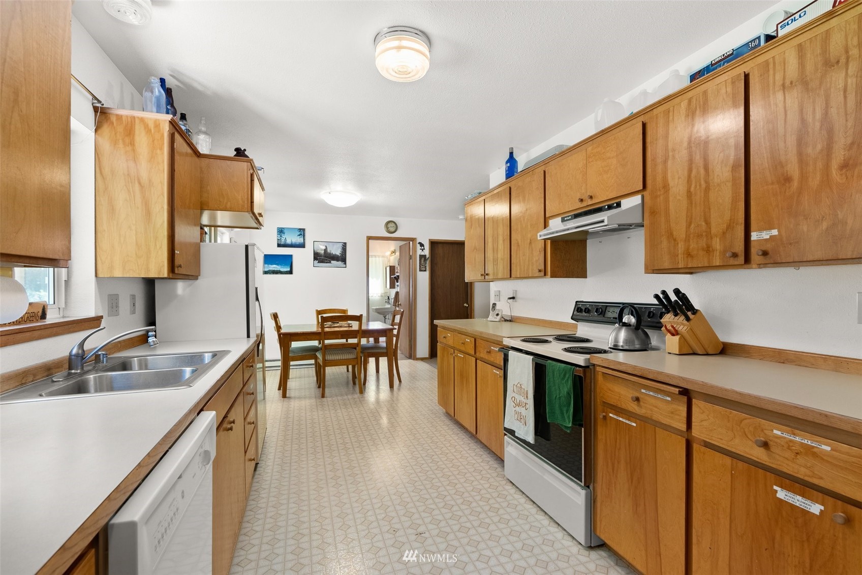 2158 Cispus Road Randle, WA 98377 - Photo 12 of 36 a kitchen with a sink stove and cabinets