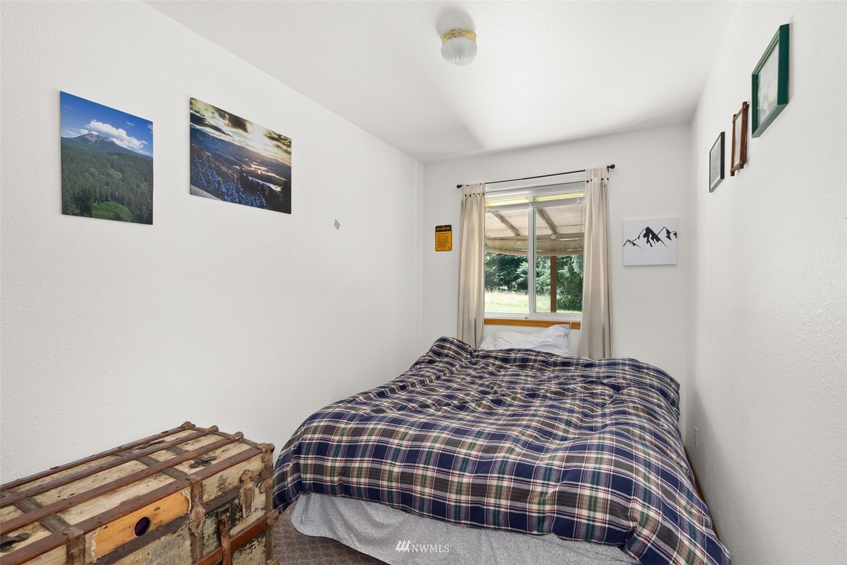 2158 Cispus Road Randle, WA 98377 - Photo 16 of 36 a bedroom with a bed and a window