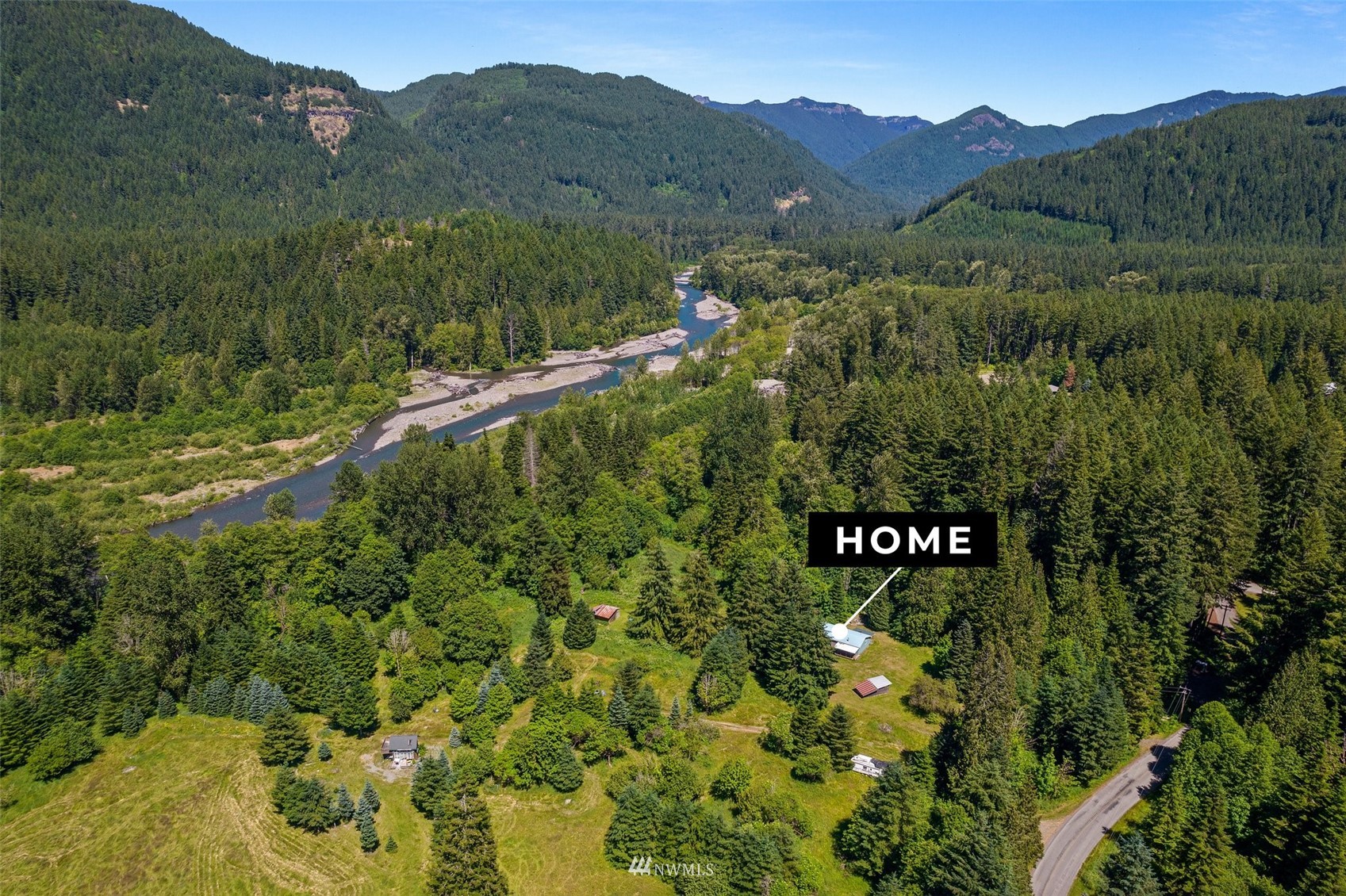 2158 Cispus Road Randle, WA 98377 - Photo 30 of 36 a view of a lush green hillside and a houses