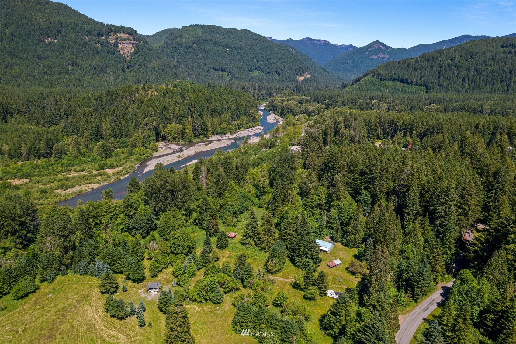 2158 Cispus Road Randle, WA 98377 - Photo 31 of 36 a view of a lush green hillside and a building