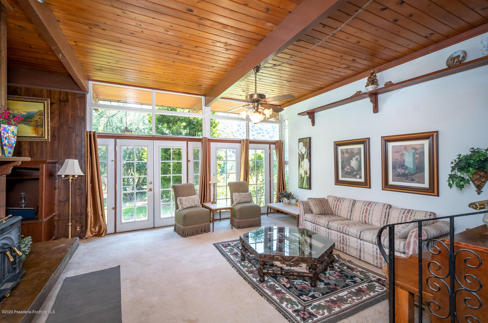 2311 Stonyvale Road Tujunga, CA 91042 - Photo 11 of 83 a living room with furniture and a floor to ceiling window