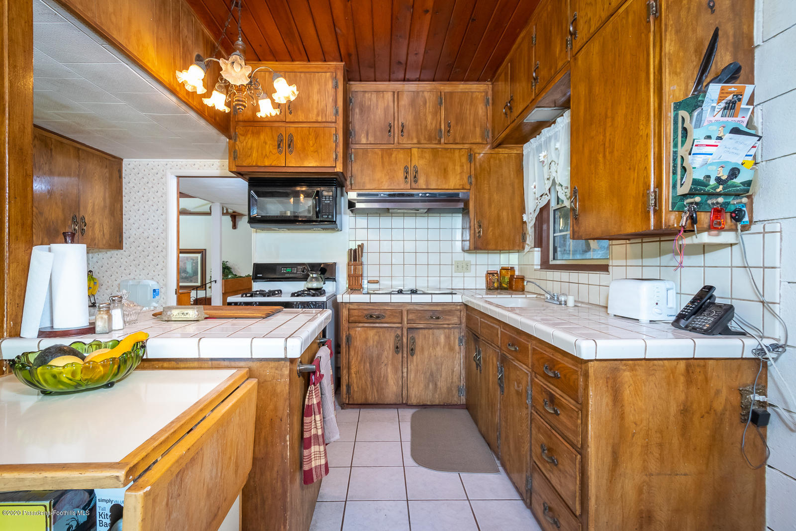 2311 Stonyvale Road Tujunga, CA 91042 - Photo 19 of 83 a kitchen with stainless steel appliances granite countertop a sink and a stove