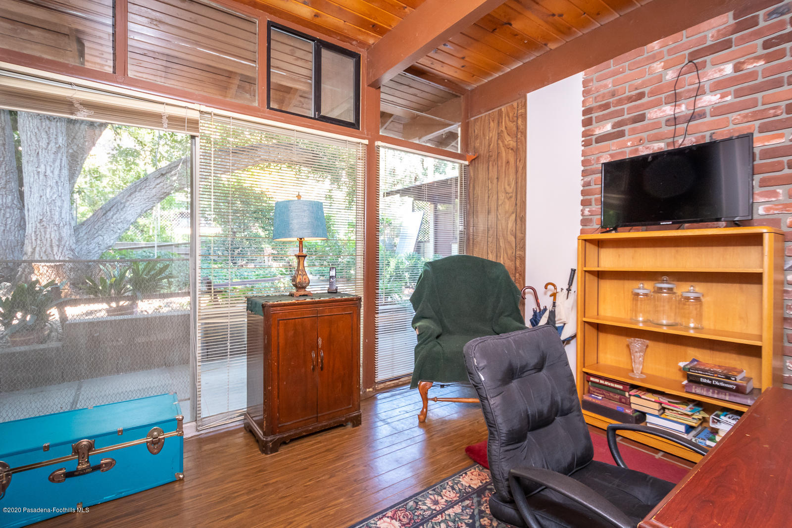 2311 Stonyvale Road Tujunga, CA 91042 - Photo 26 of 83 a living room with furniture and a flat screen tv