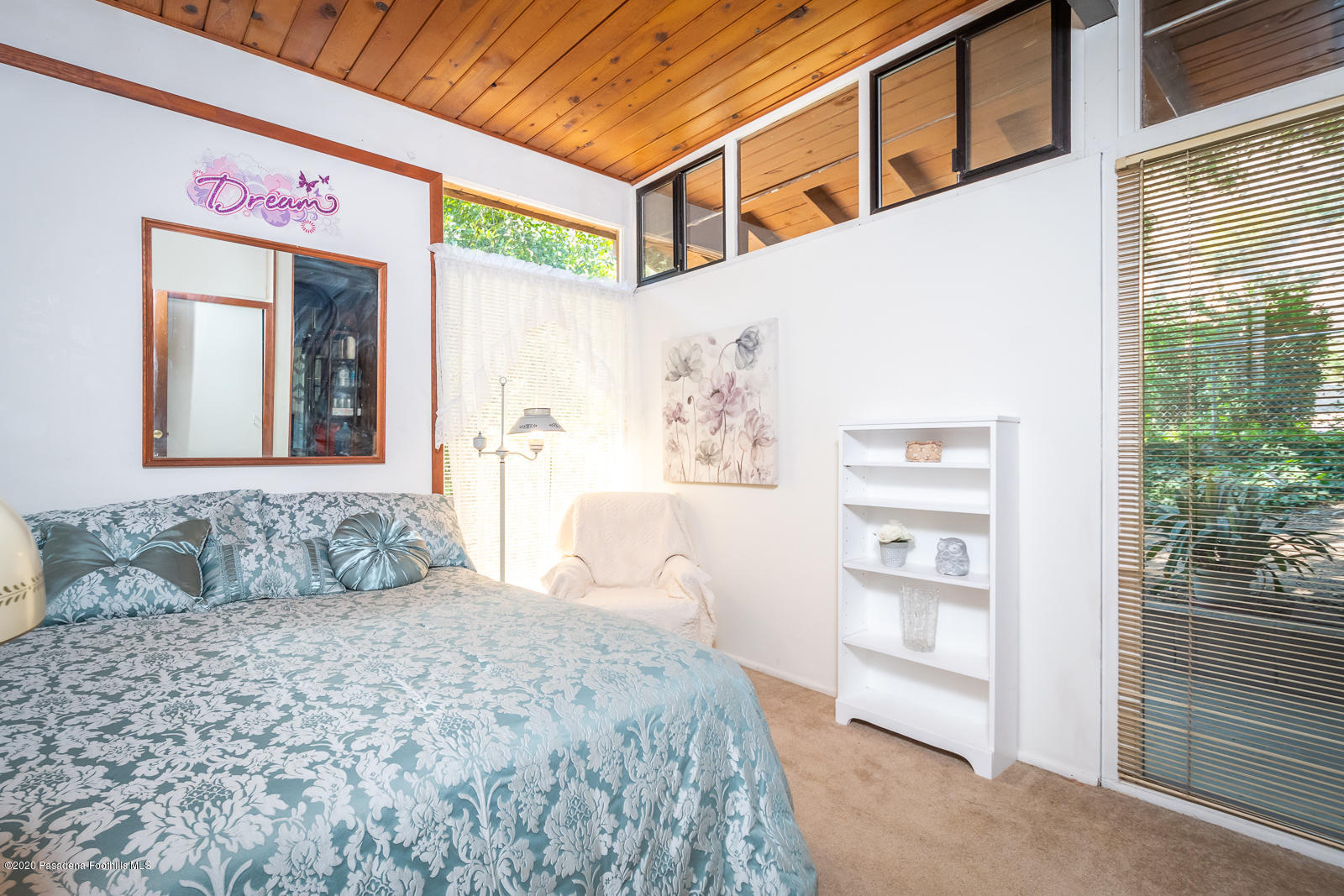 2311 Stonyvale Road Tujunga, CA 91042 - Photo 28 of 83 a bedroom with a large bed and a window