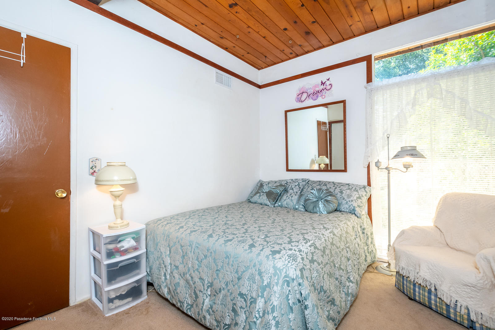 2311 Stonyvale Road Tujunga, CA 91042 - Photo 29 of 83 a bedroom with a bed and a painting on the wall
