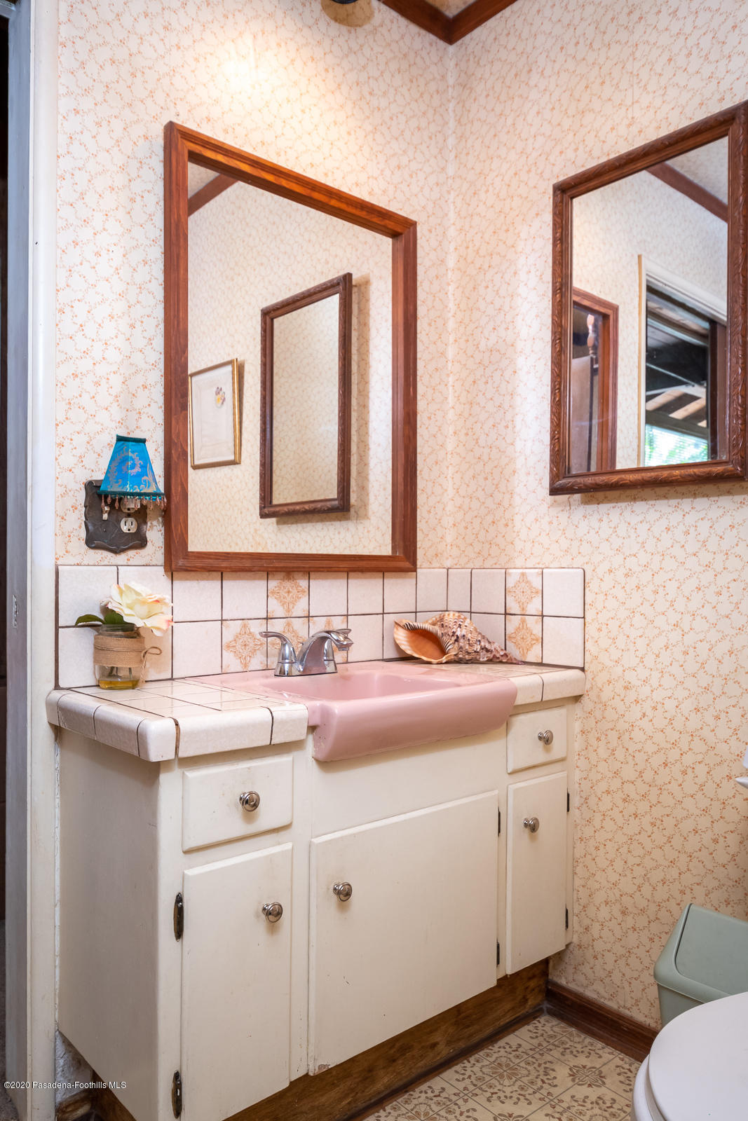 2311 Stonyvale Road Tujunga, CA 91042 - Photo 32 of 83 a bathroom with a toilet sink and mirror